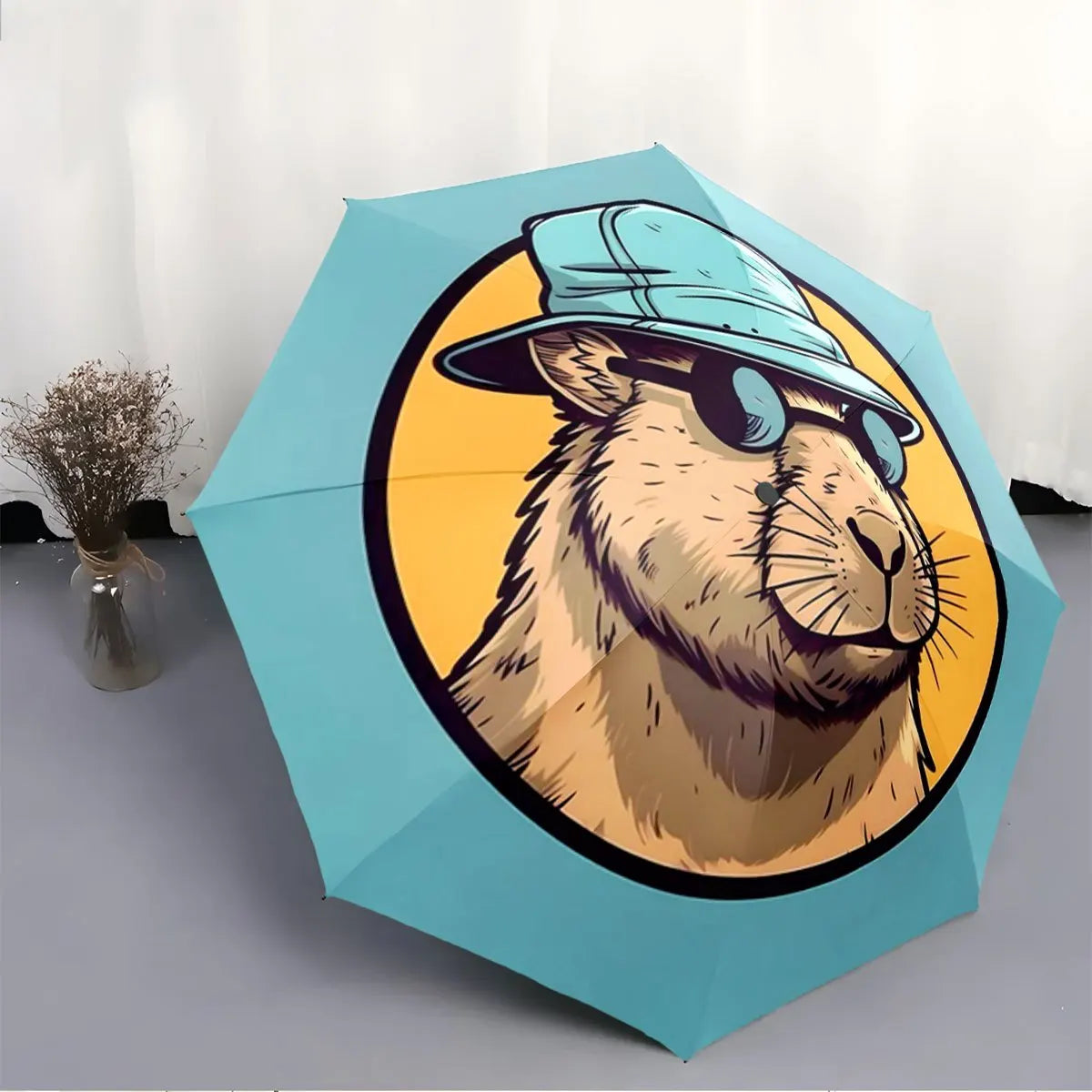 Folding umbrella Capybara wearing Fashion Glasses, blue hat, yellow background. Creative portable folding umbrella for Christm